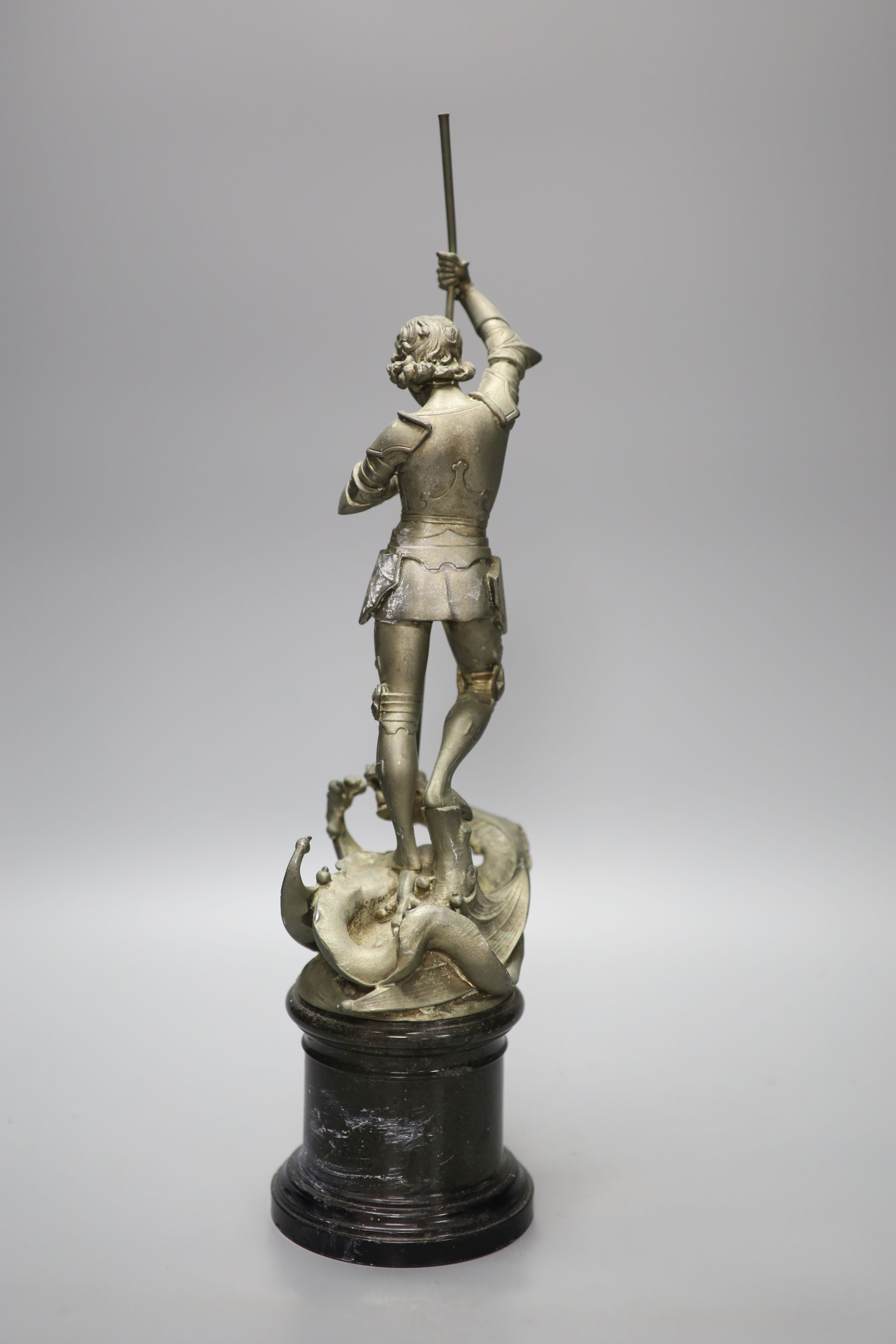 A spelter figure of St George and the Dragon, on turned marble base with vacant silver cartouche, height 41cm